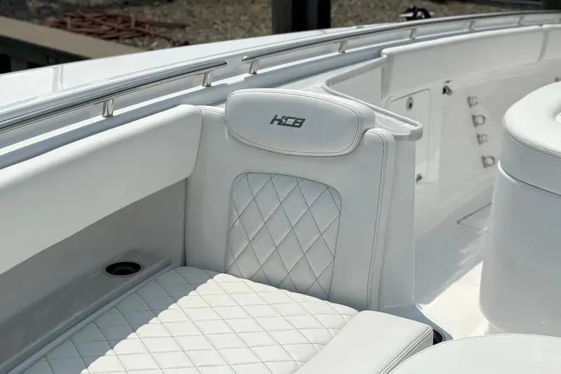  Yacht Photos Pics Luxury seating on 2025 HCB 48 Campeon boat with quilted design and logo.