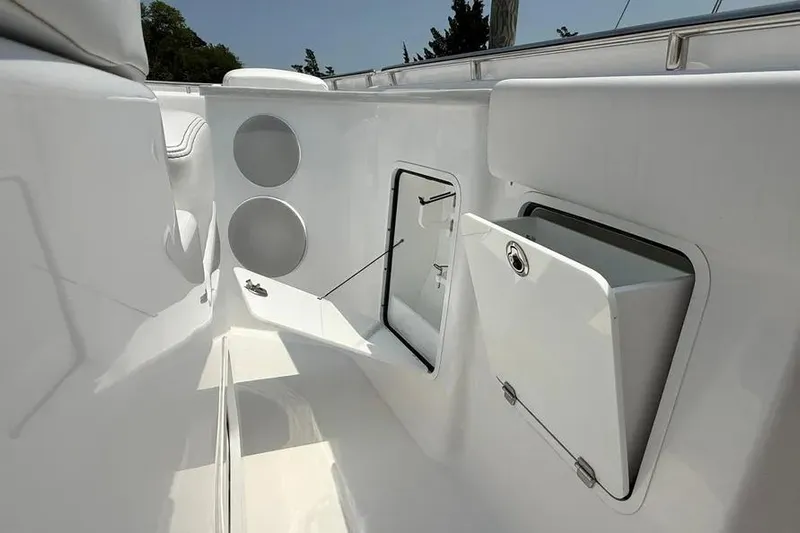  Yacht Photos Pics 2025 HCB 48 Campeon boat interior with storage compartments and sleek white design.