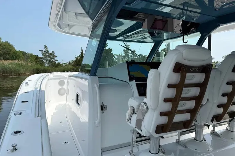  Yacht Photos Pics 2025 HCB 48 Campeon boat interior with luxurious seating and navigation system.