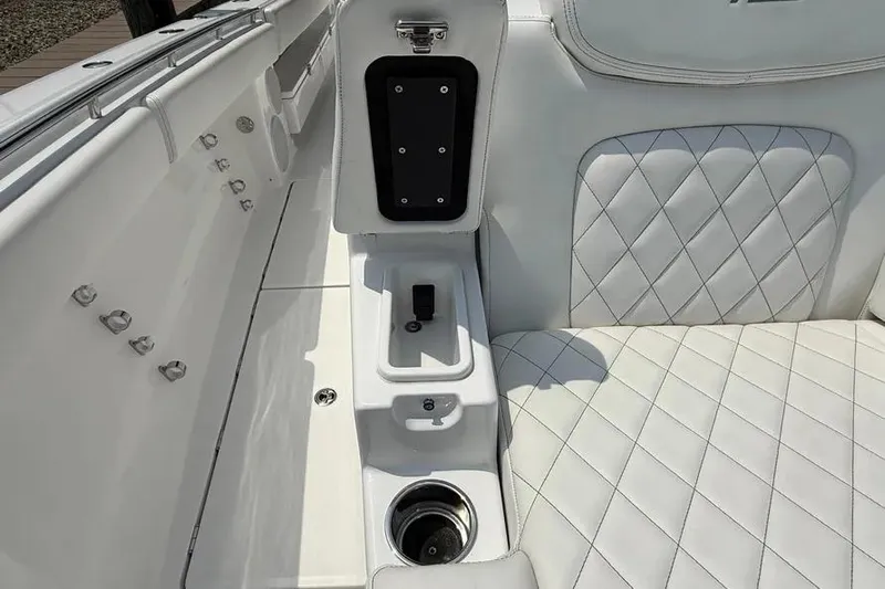  Yacht Photos Pics Luxurious interior of 2025 HCB 48 Campeon boat with quilted white seating.