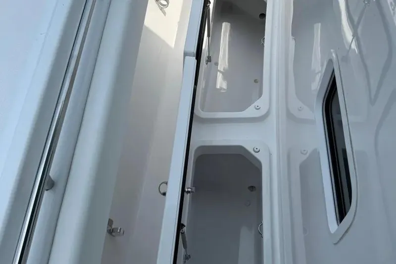  Yacht Photos Pics Interior view of 2025 HCB 48 Campeon boat, showcasing sleek white compartments.