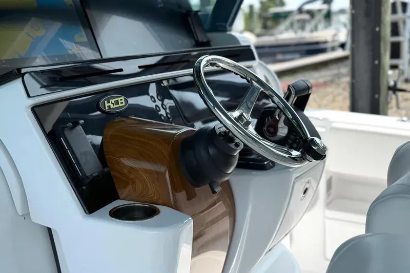  Yacht Photos Pics Steering wheel of 2025 HCB 48 Campeon boat, featuring sleek design and wood accents.