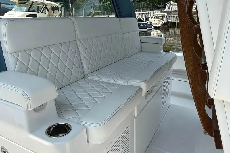  Yacht Photos Pics Luxurious seating on 2025 HCB 48 Campeon boat with quilted white upholstery.