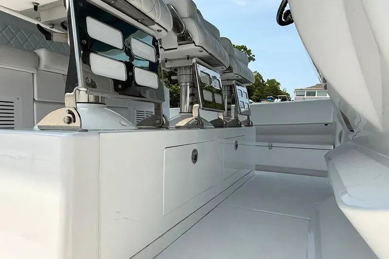  Yacht Photos Pics Interior view of 2025 HCB 48 Campeon boat, featuring sleek seating and storage compartments.