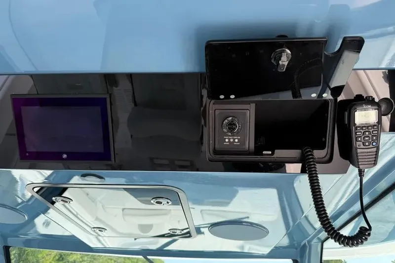  Yacht Photos Pics 2025 HCB 48 Campeon boat dashboard with communication equipment and control panel.