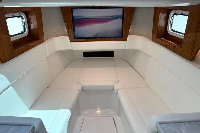  Yacht Photos Pics Luxurious interior of 2025 HCB 48 Campeon yacht with plush seating and large screen.