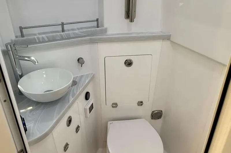  Yacht Photos Pics Luxurious bathroom in 2025 HCB 48 Campeon boat with modern fixtures and sleek design.