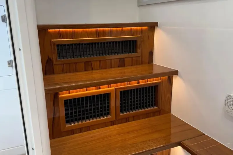  Yacht Photos Pics Wooden interior steps with ambient lighting on a 2025 HCB 48 Campeon boat.