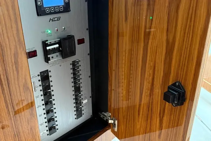  Yacht Photos Pics Electrical panel inside 2025 HCB 48 Campeon boat with wood finish door.