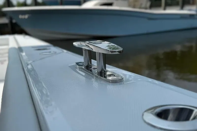  Yacht Photos Pics 2025 HCB 48 Campeon boat cleat detail with blurred background.