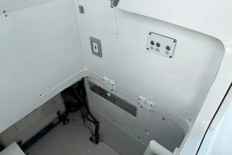  Yacht Photos Pics Interior view of 2025 HCB 48 Campeon boat, featuring control panel and storage area.