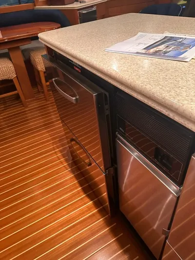 Gran Vida Yacht Photos Pics 1998 Ocean Yachts Super Sport interior with stainless steel appliances and wooden flooring.