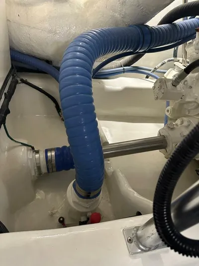 Gran Vida Yacht Photos Pics Engine room of 1998 Ocean Yachts Super Sport with blue hoses and mechanical components.