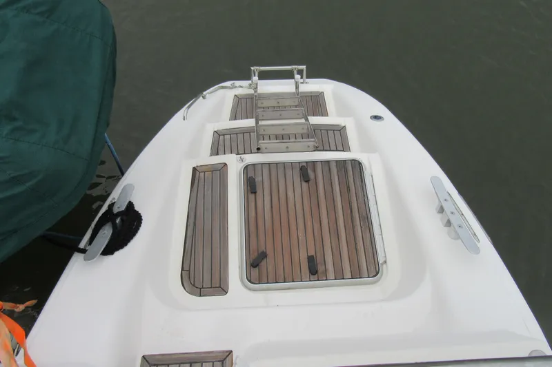 Pippin Yacht Photos Pics Catana 471 yacht deck, 2001 model, featuring teak wood finish and ladder.