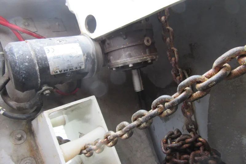 Pippin Yacht Photos Pics Rusty anchor chain and motor mechanism on a 2001 Catana 471 sailboat.