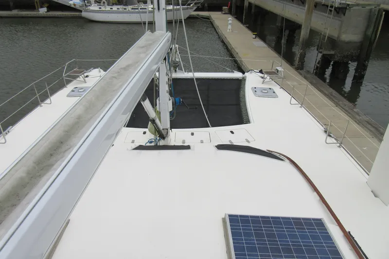 Pippin Yacht Photos Pics 2001 Catana 471 catamaran deck with solar panel, docked at marina.