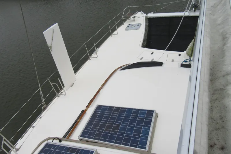 Pippin Yacht Photos Pics 2001 Catana 471 catamaran deck with solar panels and safety railings.