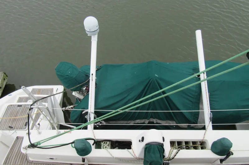 Pippin Yacht Photos Pics Catana 471 sailboat, 2001 model, with green covers and equipment on deck.