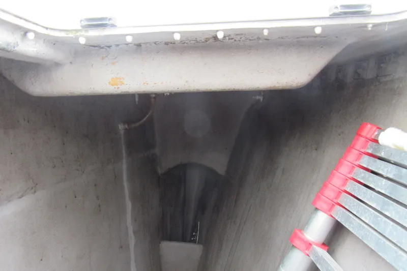 Pippin Yacht Photos Pics Interior view of a 2001 Catana 471 yacht, featuring a ladder and storage compartment.