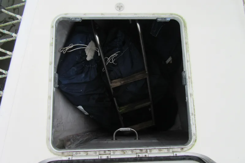 Pippin Yacht Photos Pics Storage compartment on a 2001 Catana 471 sailboat, containing a ladder and equipment.