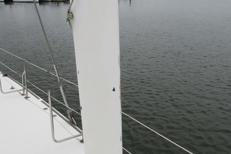 Pippin Yacht Photos Pics Catana 471 sailboat deck and mast, 2001 model, on calm water.