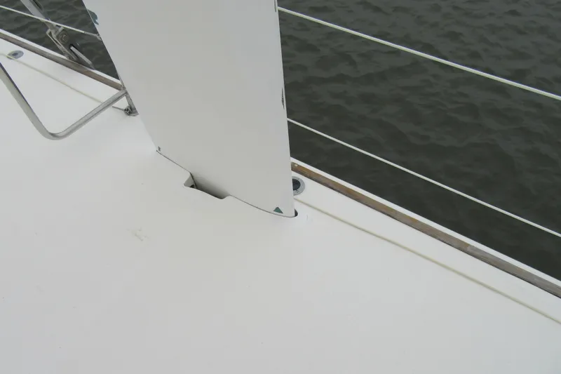 Pippin Yacht Photos Pics Catana 471 sailboat deck detail, 2001 model, with railing and water view.