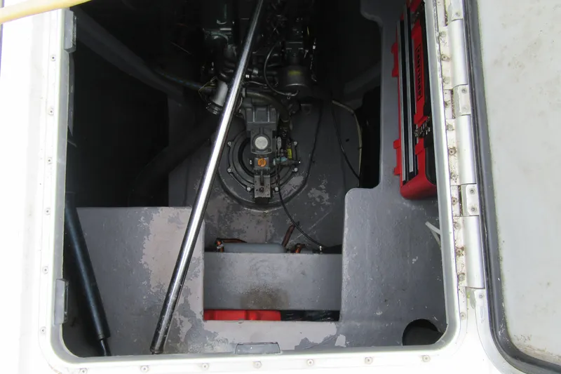 Pippin Yacht Photos Pics Engine compartment of a 2001 Catana 471 sailboat, showing mechanical components and storage.