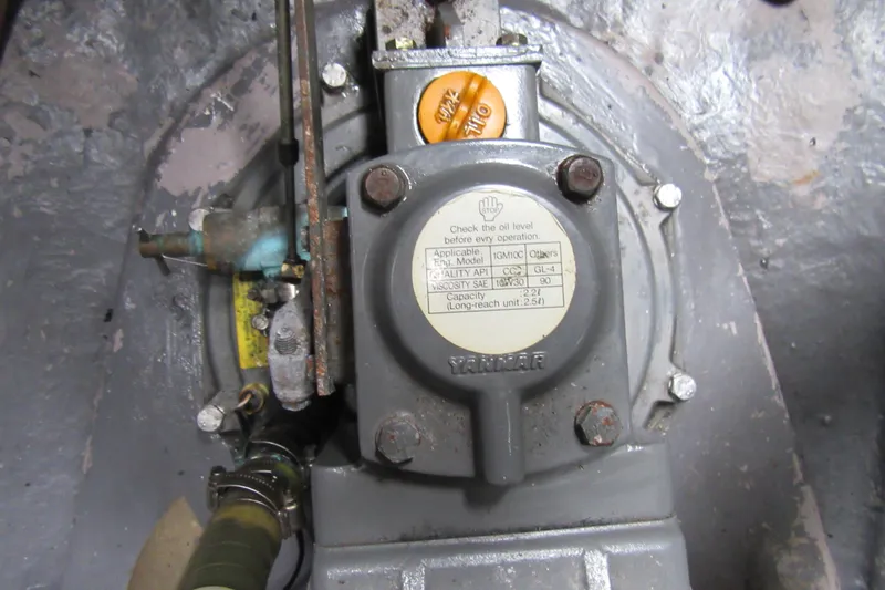 Pippin Yacht Photos Pics Engine component of a 2001 Catana 471, featuring Yanmar oil level instructions.