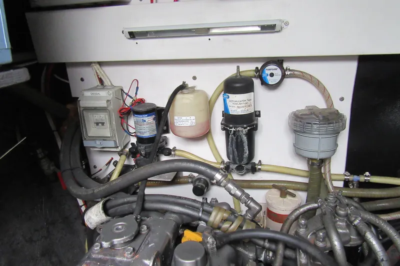 Pippin Yacht Photos Pics Engine compartment of a 2001 Catana 471, featuring various mechanical components and hoses.