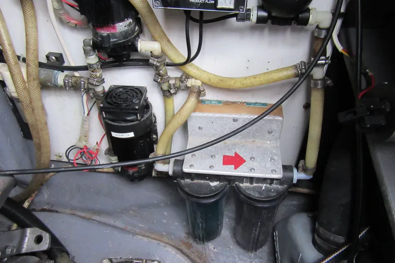 Pippin Yacht Photos Pics Engine compartment of a 2001 Catana 471 with visible hoses and components.