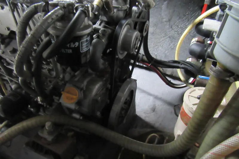 Pippin Yacht Photos Pics Engine compartment of a 2001 Catana 471 sailboat, showing hoses and components.