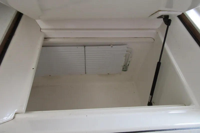 Pippin Yacht Photos Pics Open storage compartment on 2001 Catana 471 yacht, featuring hydraulic support.