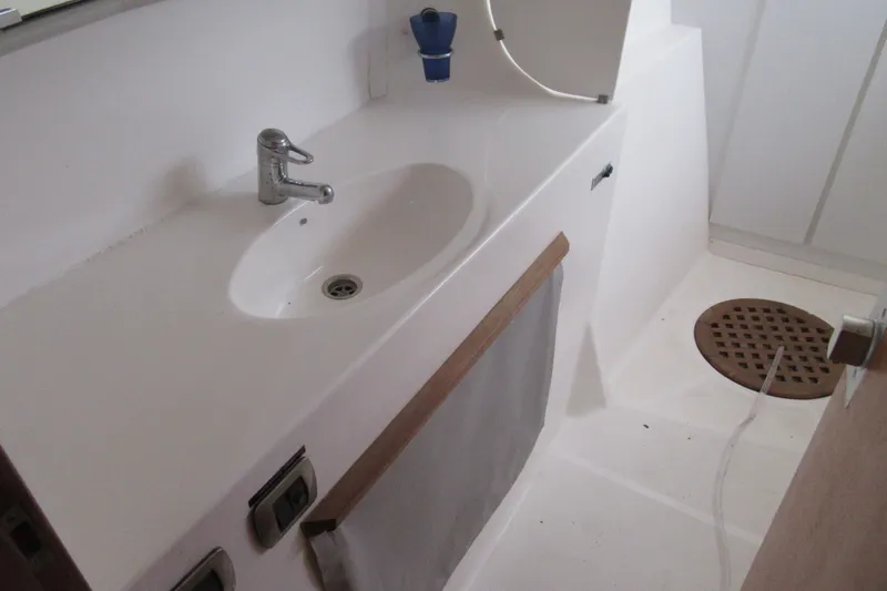 Pippin Yacht Photos Pics Bathroom sink area on a 2001 Catana 471 yacht, featuring a modern faucet and drain.