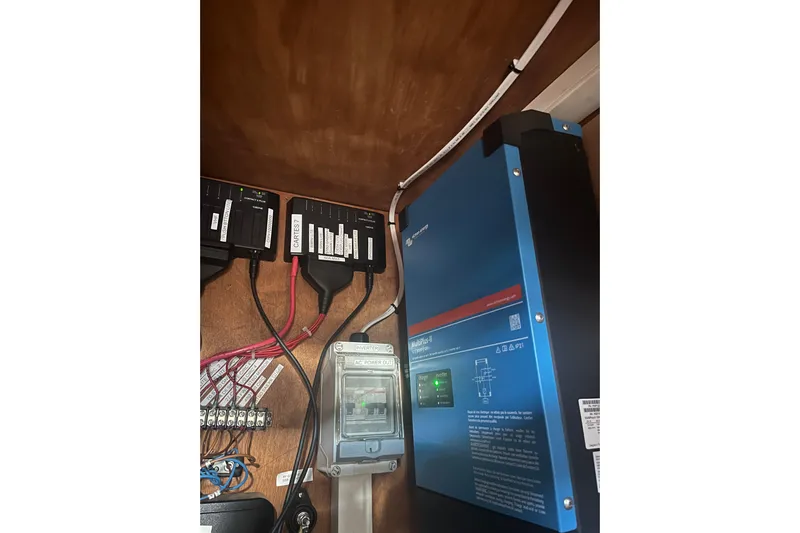 Pippin Yacht Photos Pics Electrical system inside a 2001 Catana 471, featuring a Victron Energy MultiPlus inverter.
