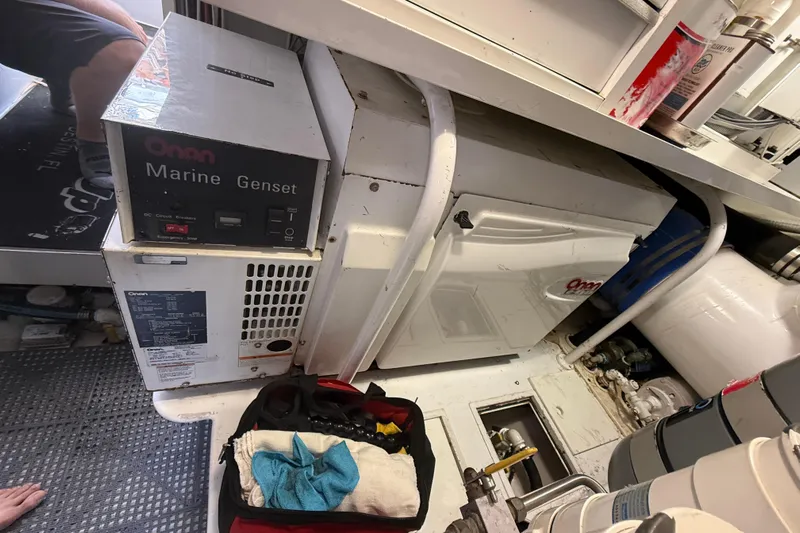 Enclosed Bridge W/tower Yacht Photos Pics Engine room of 2004 Viking 65 Enclosed Bridge with Onan Marine Genset.