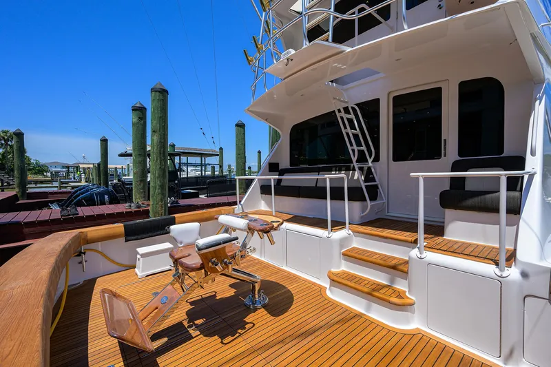 Enclosed Bridge W/tower Yacht Photos Pics 2004 Viking 65 Enclosed Bridge w/Tower yacht deck with seating and fishing chair.