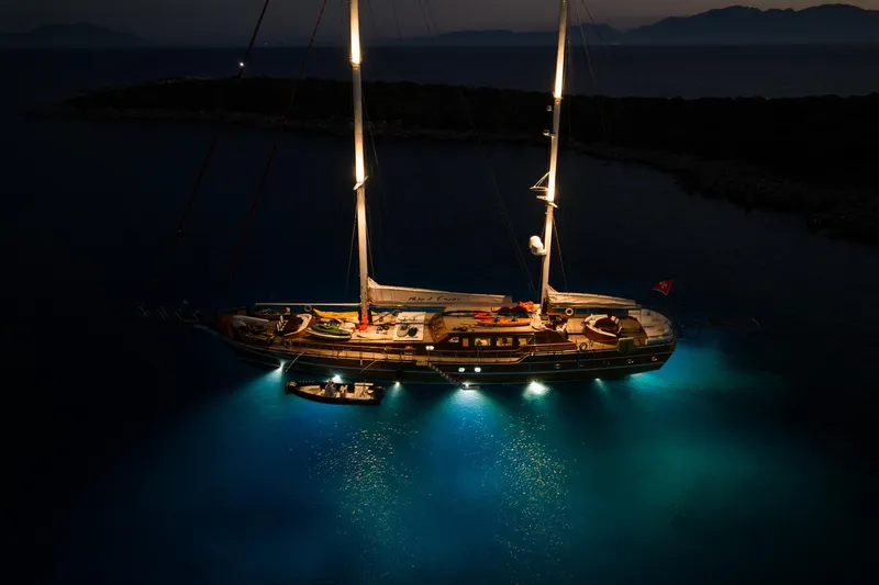 Take It Easier Yacht Photos Pics Luxurious 2007 Custom Gulet Motorsailer illuminated at night on serene waters.