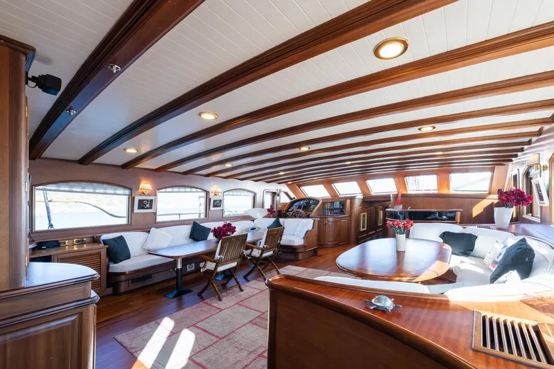 Take It Easier Yacht Photos Pics Luxurious interior of 2007 Custom Gulet Motorsailer with elegant wood finish and plush seating.