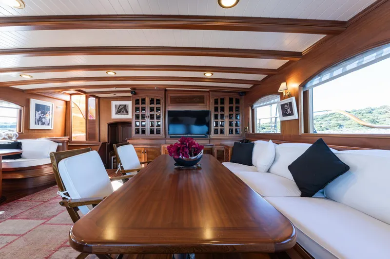 Take It Easier Yacht Photos Pics Luxurious interior of 2007 Custom Gulet Motorsailer with elegant wood finish and comfortable seating.