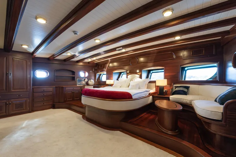Take It Easier Yacht Photos Pics Luxurious 2007 Custom Gulet Motorsailer cabin with elegant wood interior and plush furnishings.