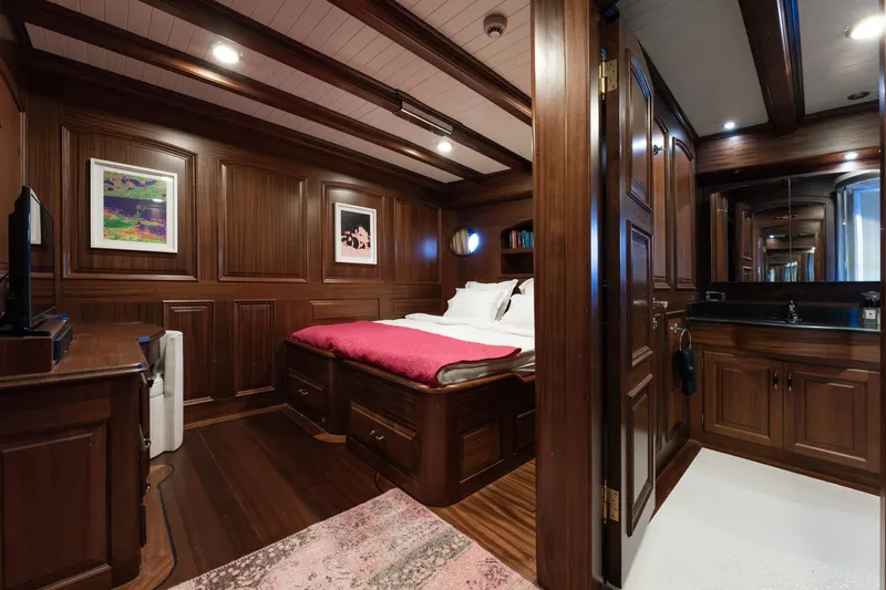 Take It Easier Yacht Photos Pics Luxurious 2007 Custom Gulet Motorsailer cabin with rich wood paneling and elegant decor.