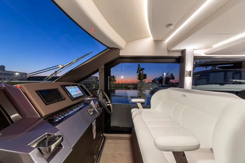  Yacht Photos Pics Interior of 2024 Galeon 400 Fly yacht with modern helm and sunset view.