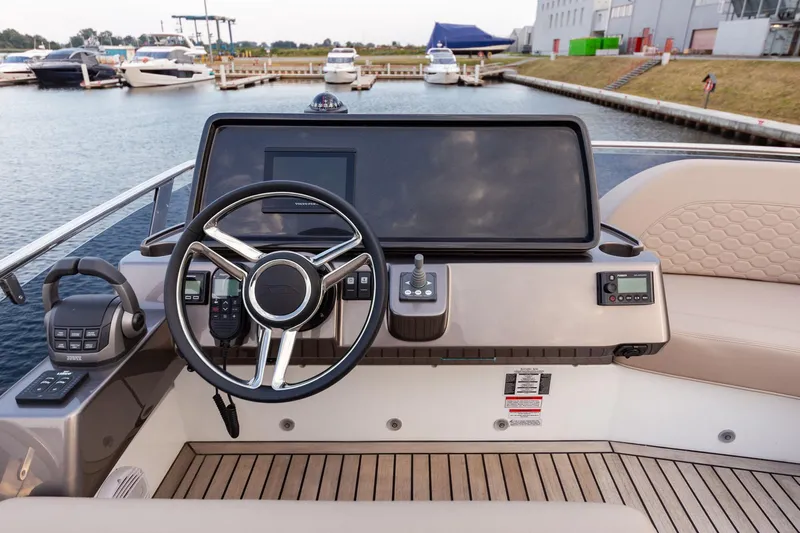  Yacht Photos Pics 2024 Galeon 400 Fly yacht helm with modern controls and waterfront view.
