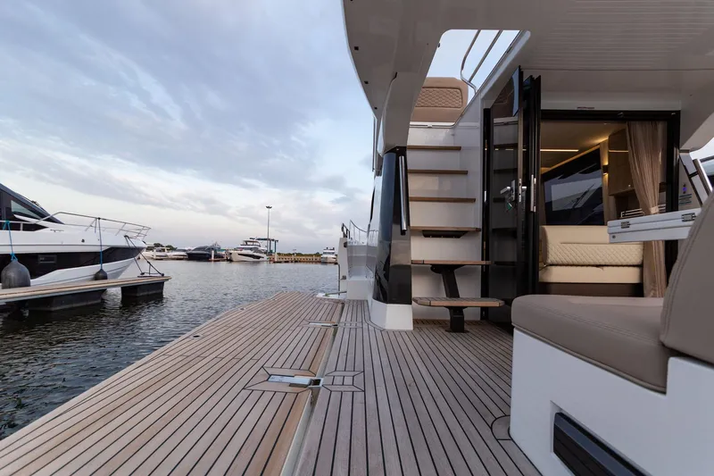  Yacht Photos Pics 2024 Galeon 400 Fly yacht docked, showcasing luxurious deck and interior.