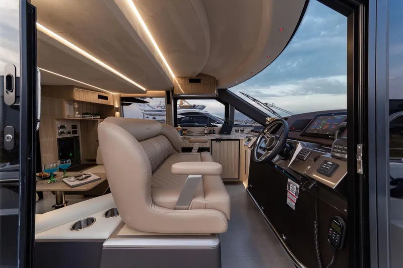  Yacht Photos Pics Luxurious interior of 2024 Galeon 400 Fly yacht with modern helm and seating.