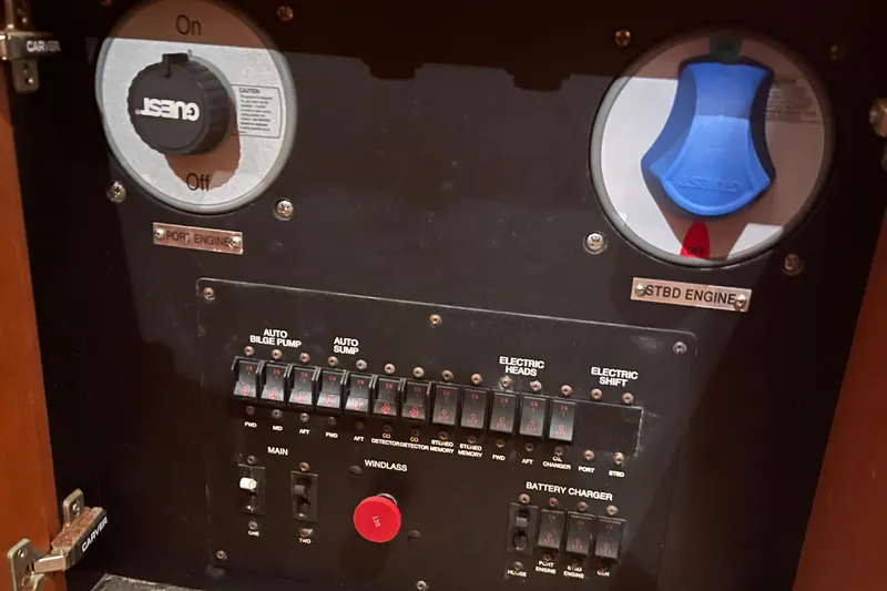 Sudden Comfort Yacht Photos Pics Control panel of a 2001 Carver 444 Cockpit Motor Yacht, featuring engine and electrical switches.