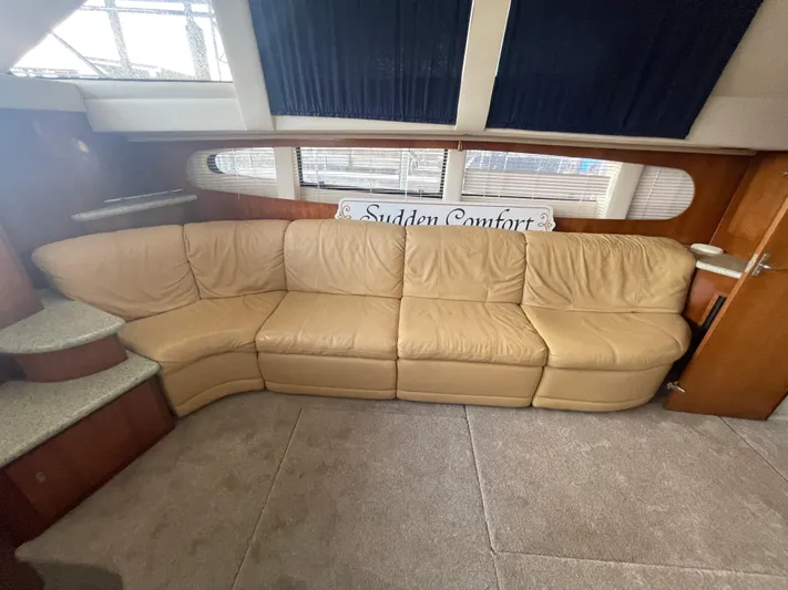 Sudden Comfort Yacht Photos Pics Luxurious interior of 2001 Carver 444 Cockpit Motor Yacht with beige leather sofa.