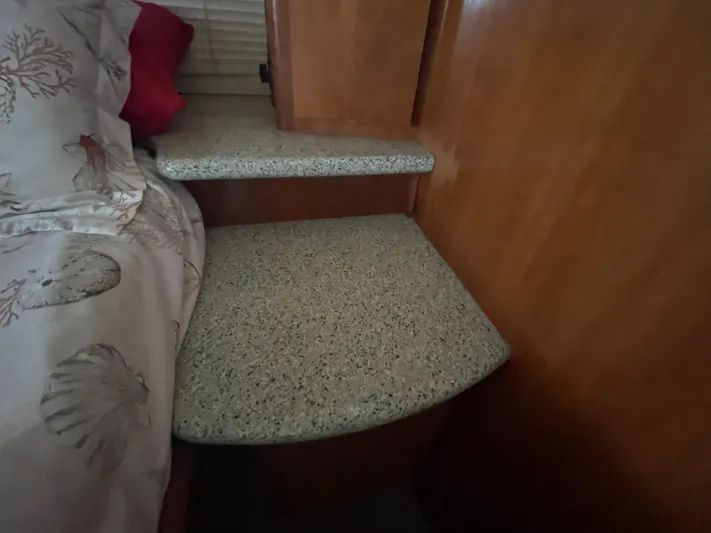 Sudden Comfort Yacht Photos Pics Interior of 2001 Carver 444 Cockpit Motor Yacht with bed and wooden cabinetry.