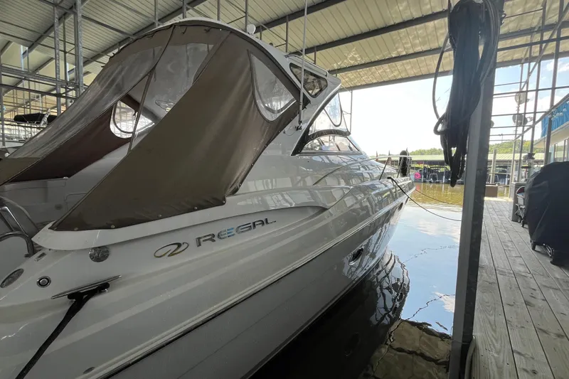 River Dancer Yacht Photos Pics 2007 Regal 3760 IB Commodore boat docked in covered marina.