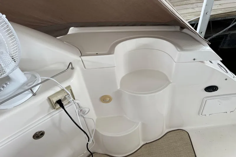 River Dancer Yacht Photos Pics 2007 Regal 3760 IB Commodore boat interior with steps and electrical outlet.